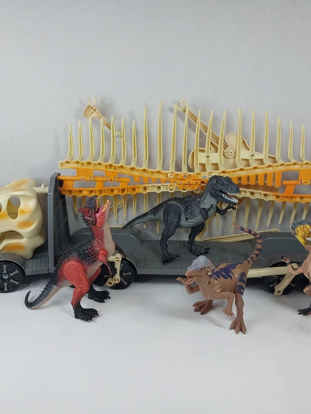 Kid Galaxy Dino Hauler Transport With 4 Roaring Jurassic Dinosaurs light up eyes